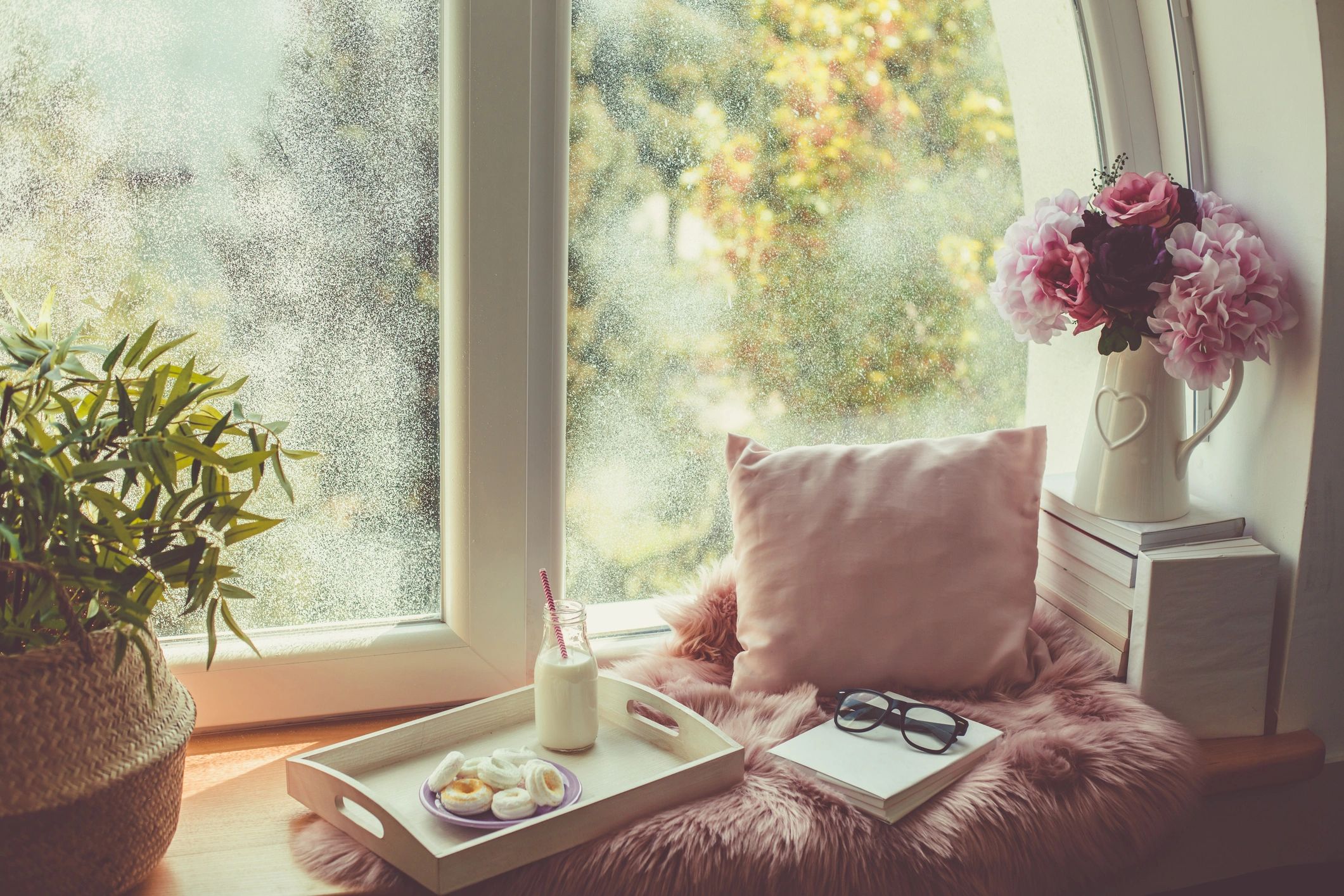 Cozy relaxation corner with books and a warm drink