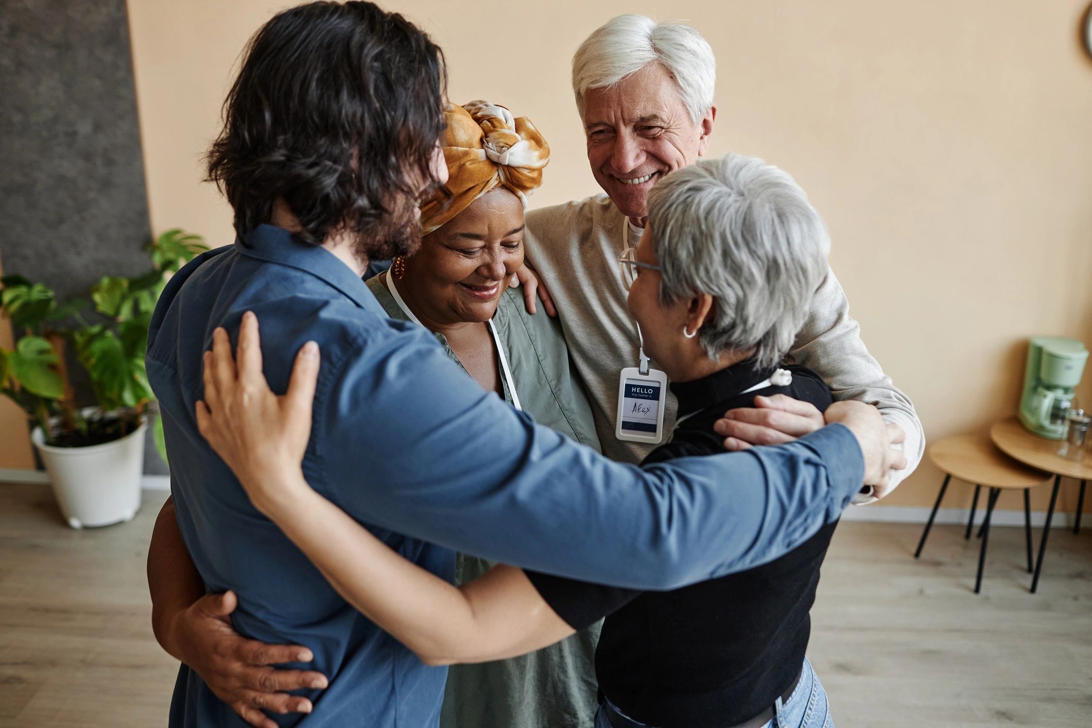 People embracing in a supportive community circle