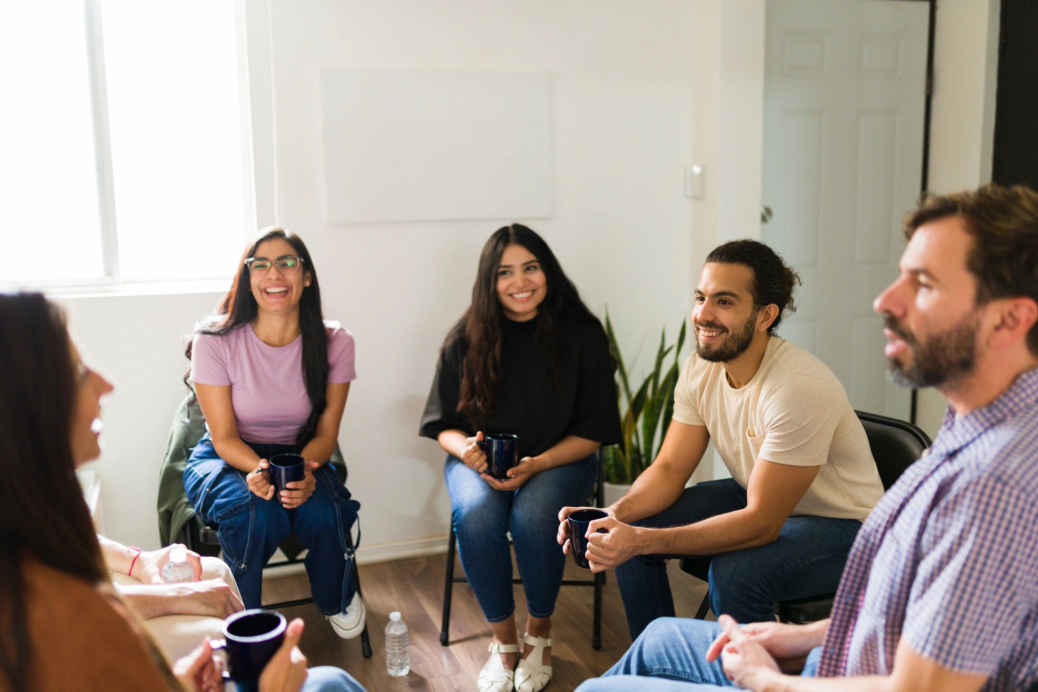 Community members connecting in a calm support circle
